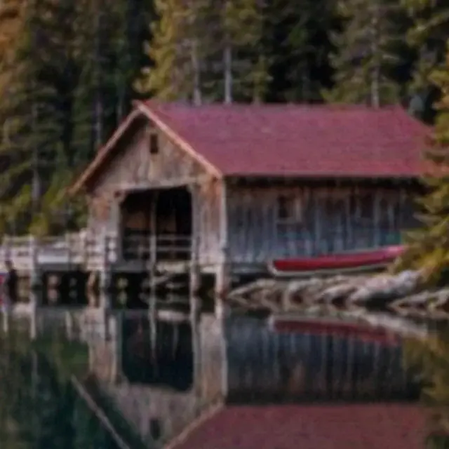 Soft photo of a mountain lake with a boathouse, detail crop: Pic Refiner v2.1