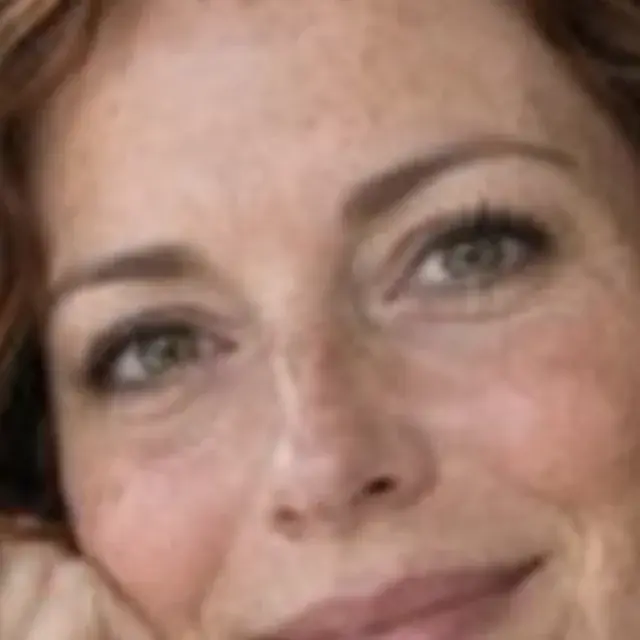 Small blurry portrait of a woman with freckles, detail crop: Original
