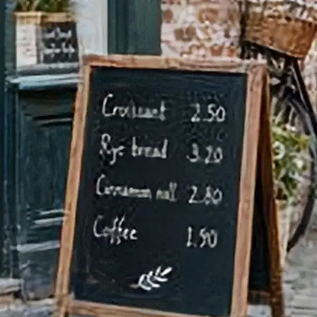 Small photo of a bakery with a chalkboard menu, detail crop: Pic Refiner v2.1